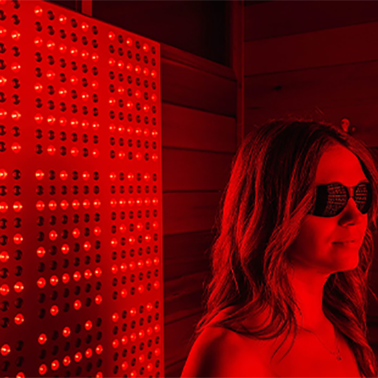 woman using red light therapy